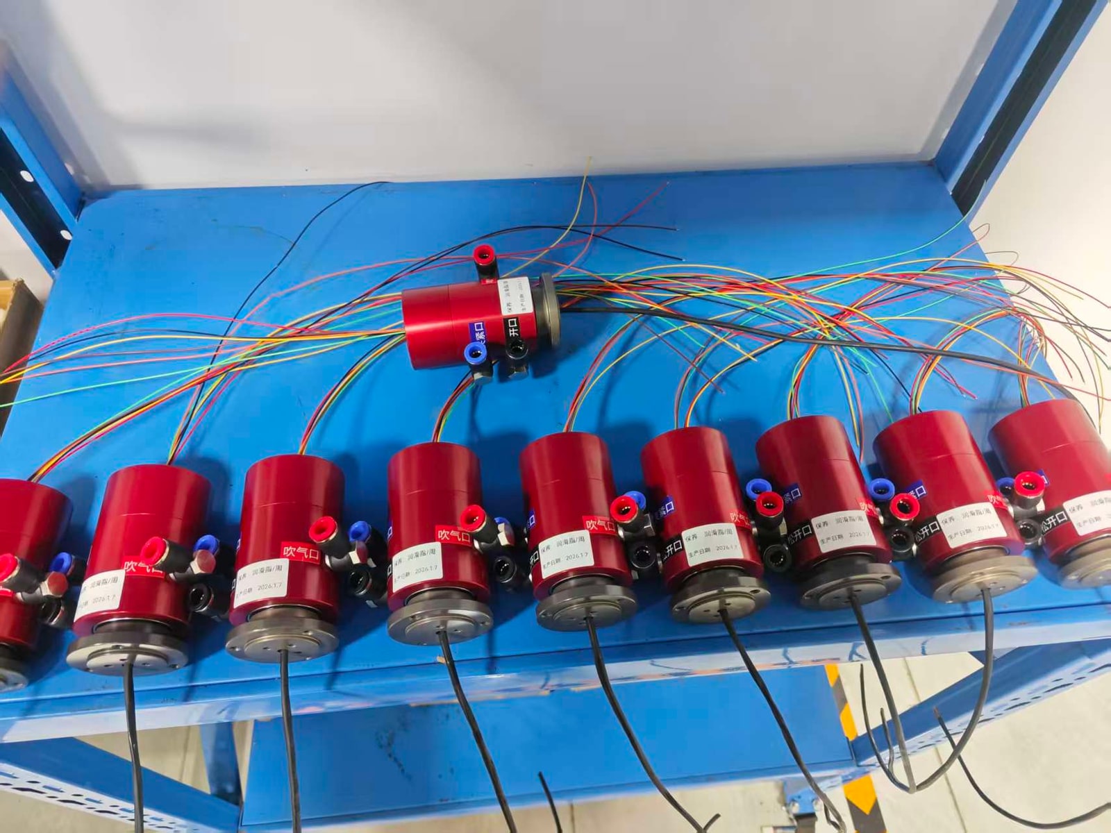Batch-prepared pneumatic rotary unions with labeled air ports and electrical leads