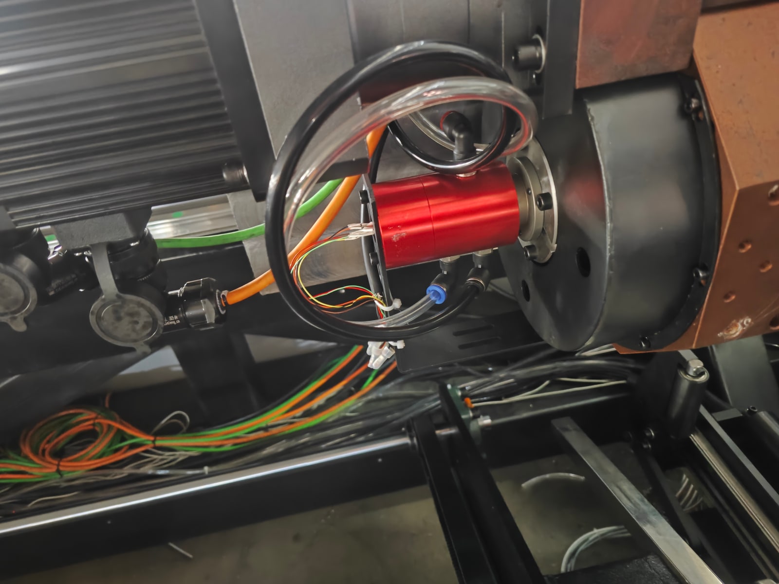 Pneumatic rotary union with electrical leads installed on a rotating chuck assembly