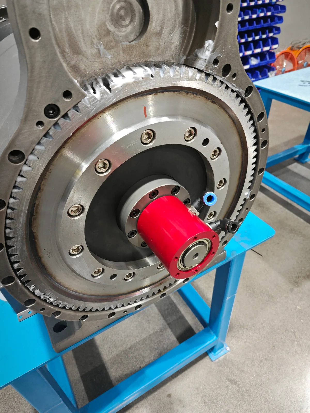 Close view of a pneumatic rotary union mounted at the center of a laser tube cutting rear chuck