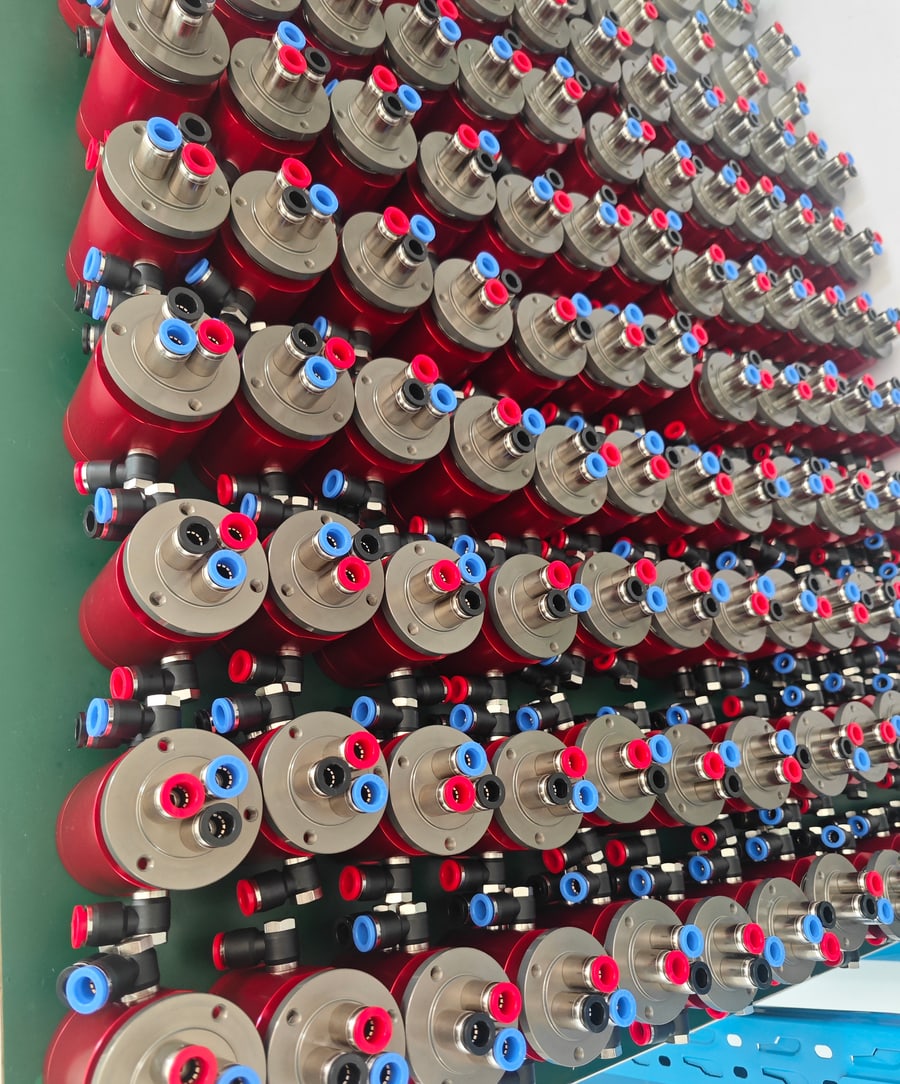 Assembled pneumatic rotary unions waiting in the production inspection queue